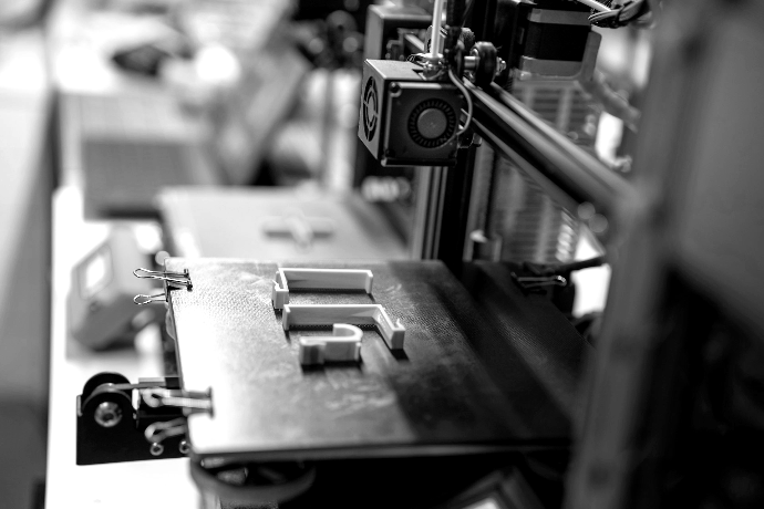Validation a close up of a machine with orange pieces on it